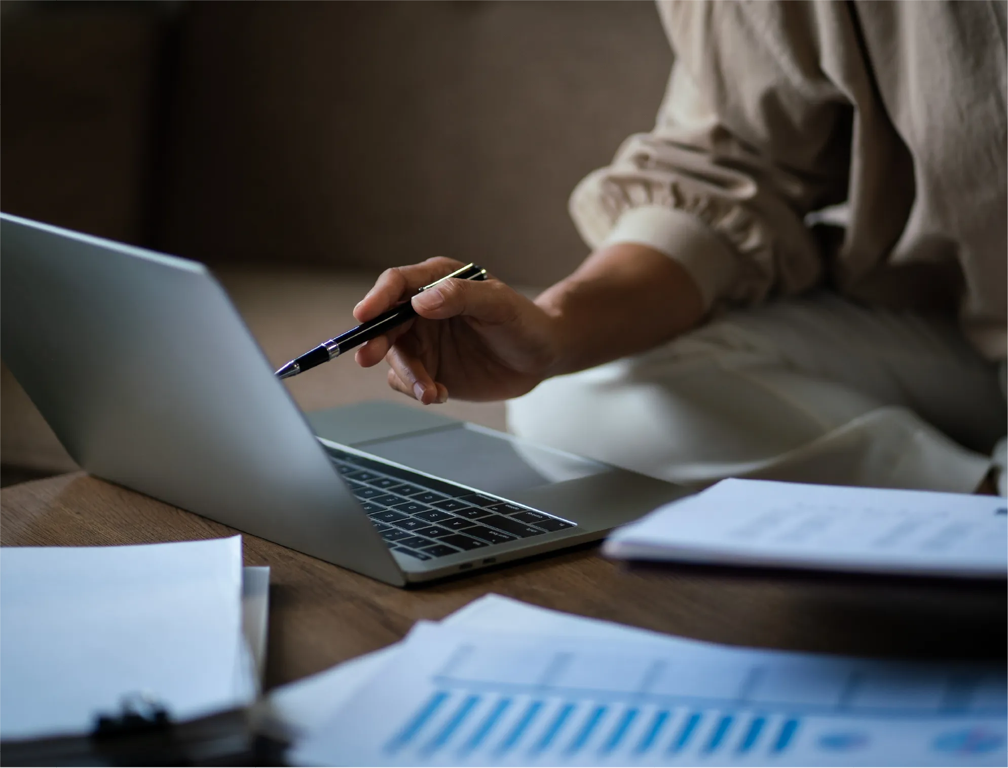 chapter-7-bankruptcy-process Person reviewing financial documents on a laptop during the Chapter 7 bankruptcy process