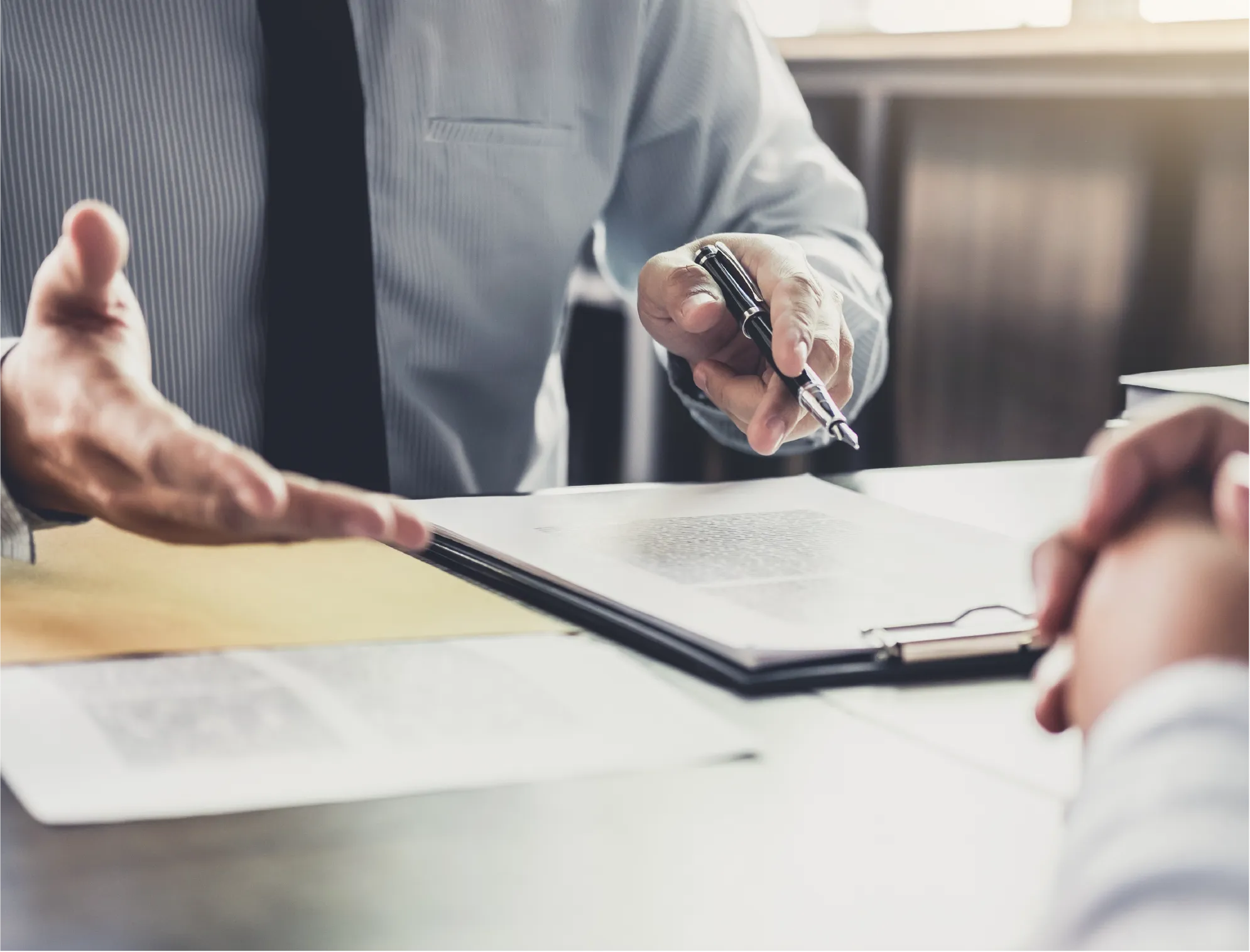 choosing-bankruptcy-chapters Bankruptcy attorney reviewing paperwork with a client to choose the right bankruptcy chapter